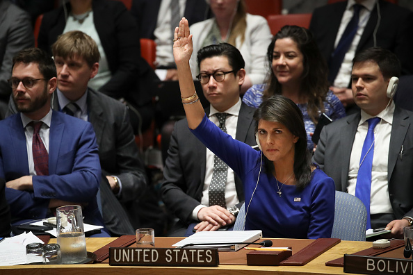 United States Ambassador to the United Nations Nikki Haley vetoes a Russian proposed draft resolution that would 'condemn the aggression against Syria by the U.S. and its allies' during a United Nations Security Council emergency meeting concerning the situation in Syria, at United Nations headquarters, April 14, 2018 in New York City. (Getty)