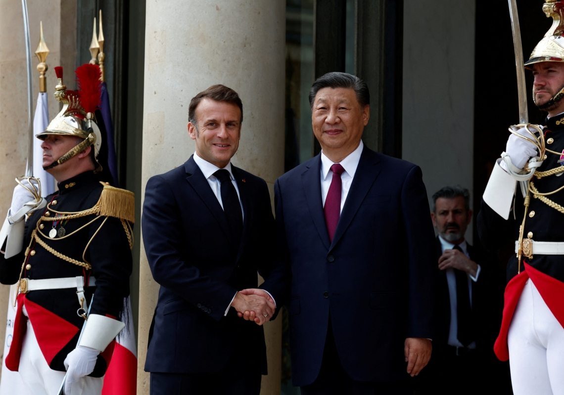 French President Emmanuel Macron welcomes China&#039;s President Xi Jinping as he arrives for a meeting at the Elysee Palace in Paris as part of the Chinese president&#039;s two-day state visit to France on May 6, 2024. 